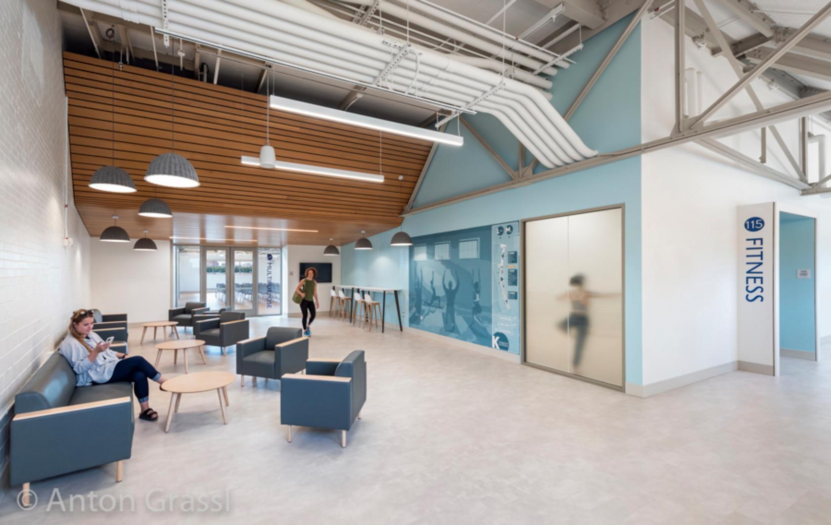 Interior view of community center, including building envelope repairs, upgrades to exterior entrances and stairs, improved exterior views, and comprehensive interior reconfiguration and finishes